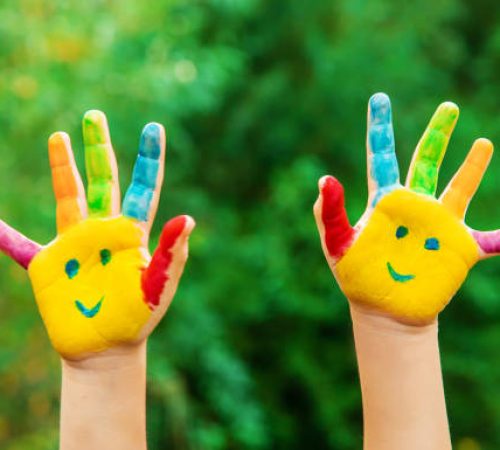 children hands in colors. Summer photo. Selective focus. nature